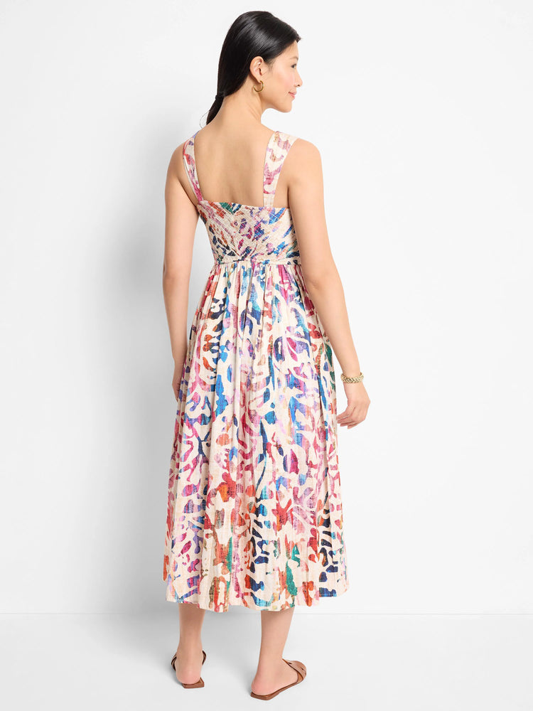 Midi dress, sleeveless, off-white background, multicolored abstract print (red, pink, blue).  Square neckline, pleated skirt.