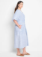 Blue and white vertical striped midi dress with a belted waist and puff sleeves.