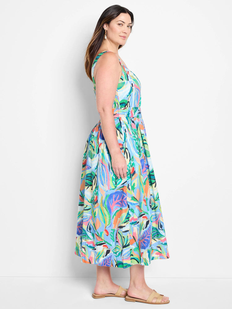 Midi sleeveless dress, light blue base with multicolored abstract leaf print.  Features a belted waist.