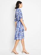 Blue, beige, and white shibori print belted midi dress with short sleeves.