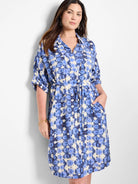 Blue and off-white tie-dye patterned shirt dress with a self-tie belt and short sleeves.  Has pockets.