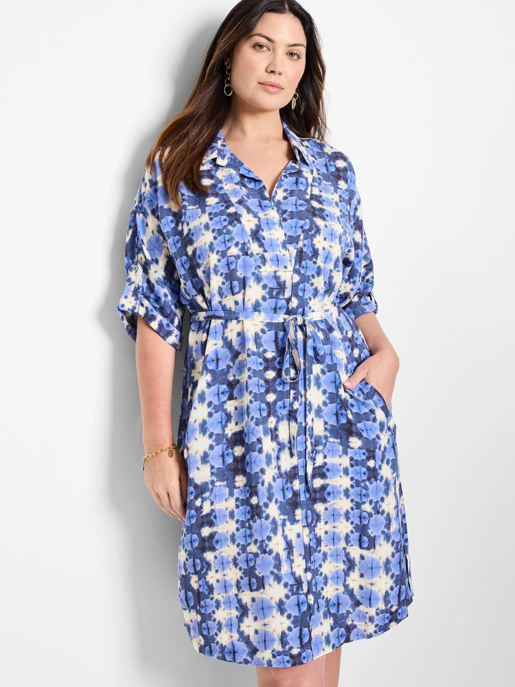 Blue and off-white tie-dye patterned shirt dress with a self-tie belt and short sleeves.  Has pockets.