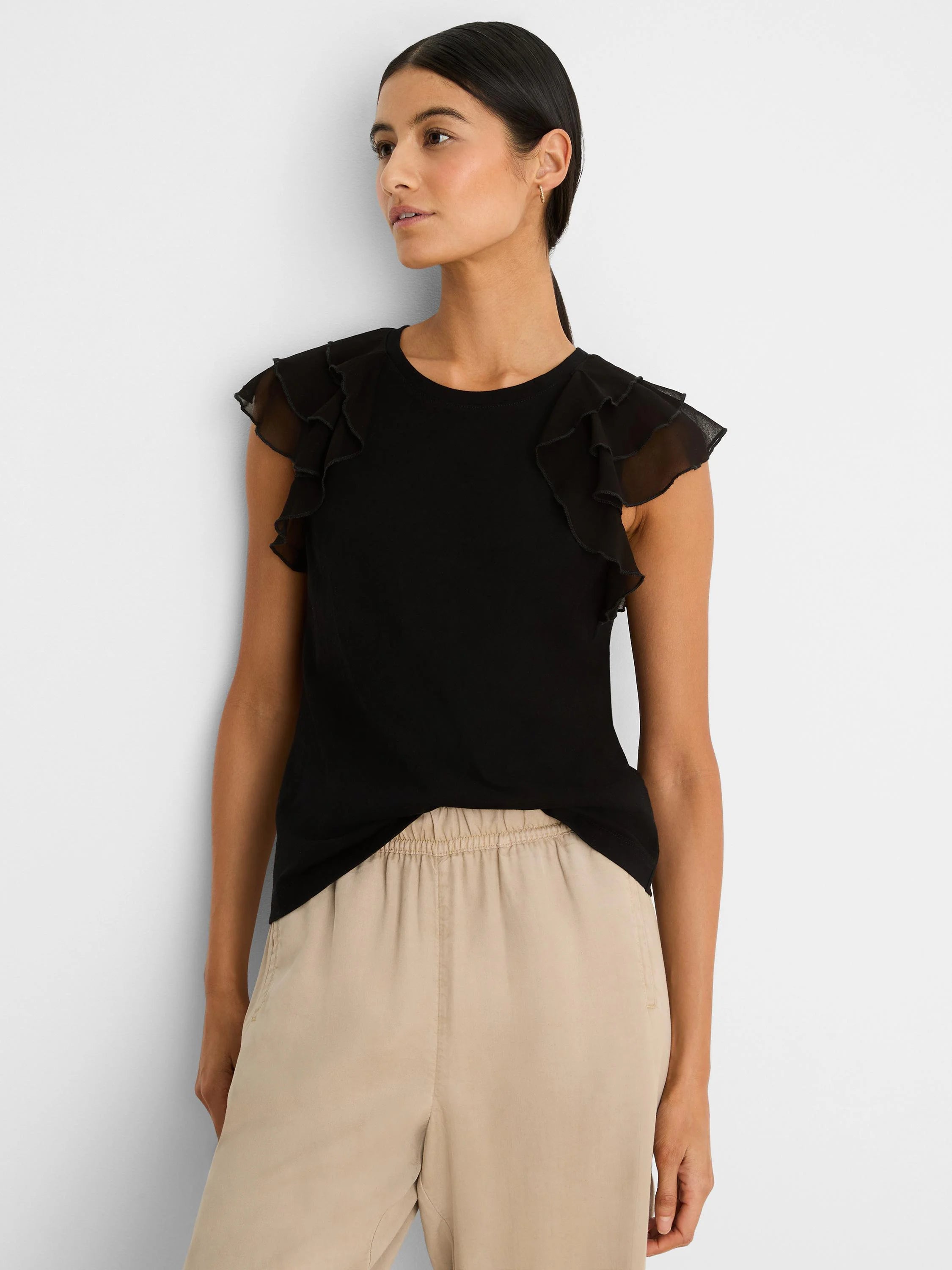 Black top with chiffon ruffle cap sleeves.