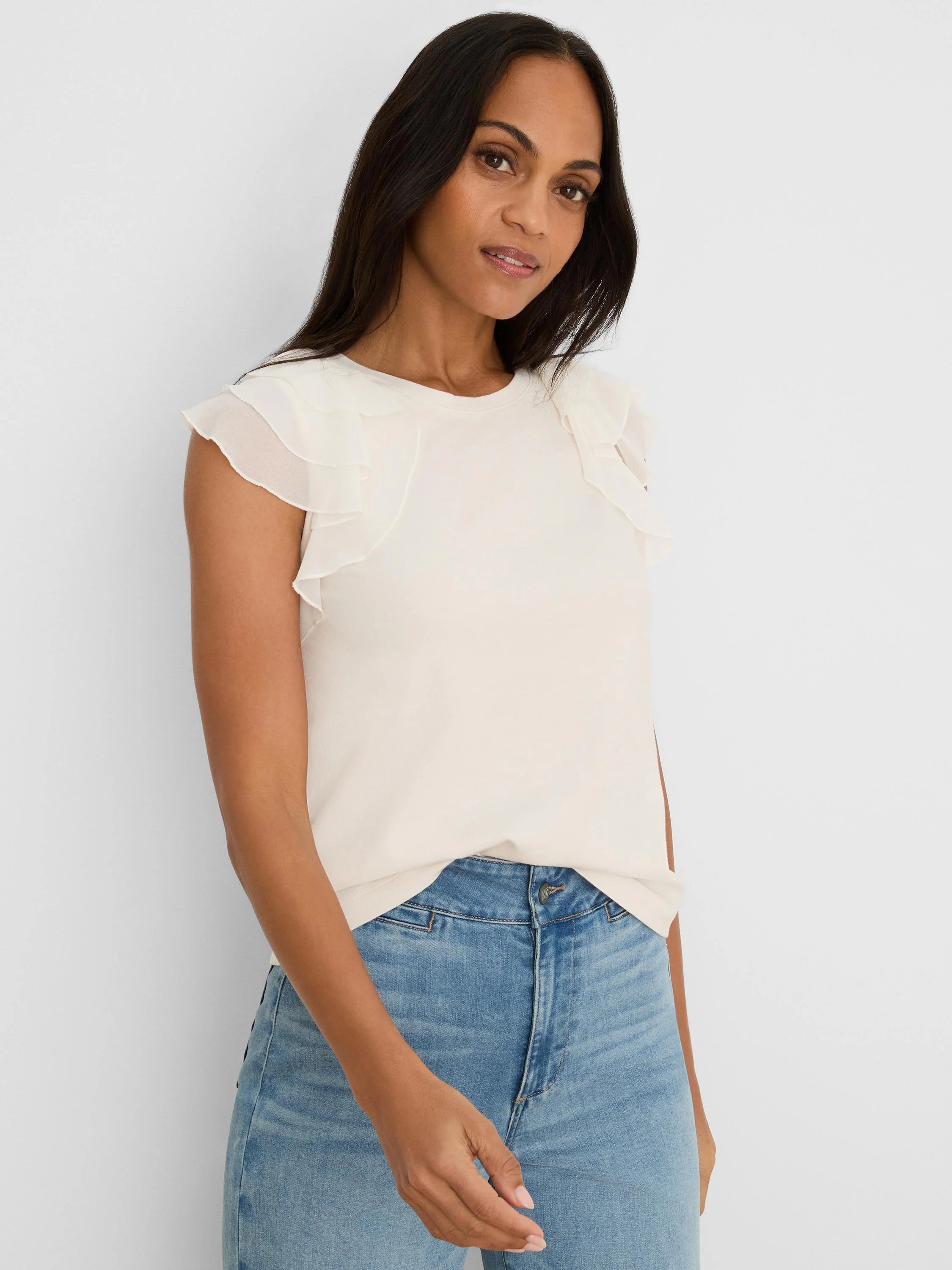 Cream top with round neck and tiered chiffon ruffle short sleeves.
