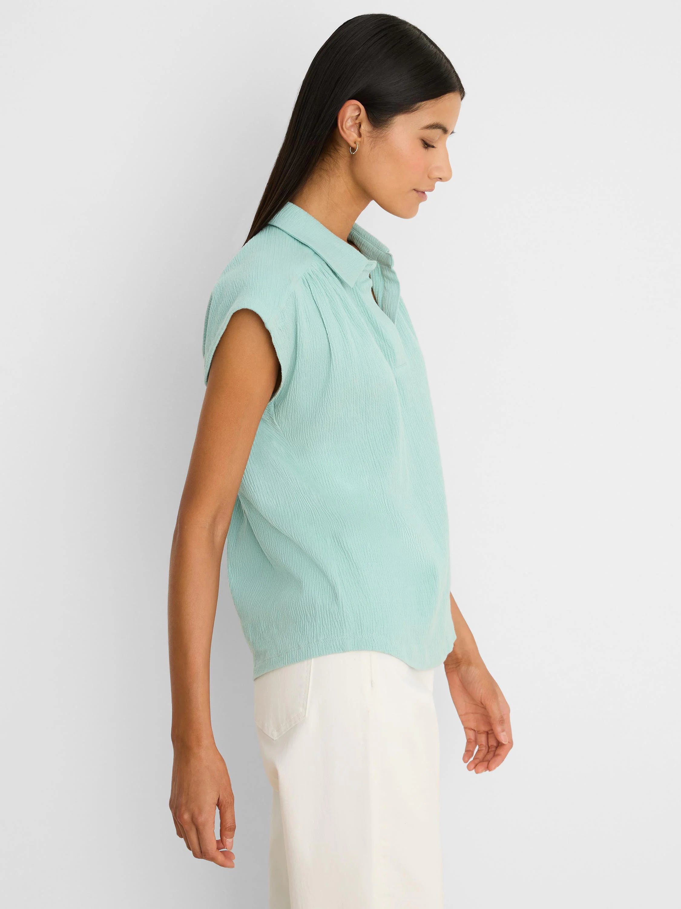Pale aqua crinkle top with a collar and short sleeves.