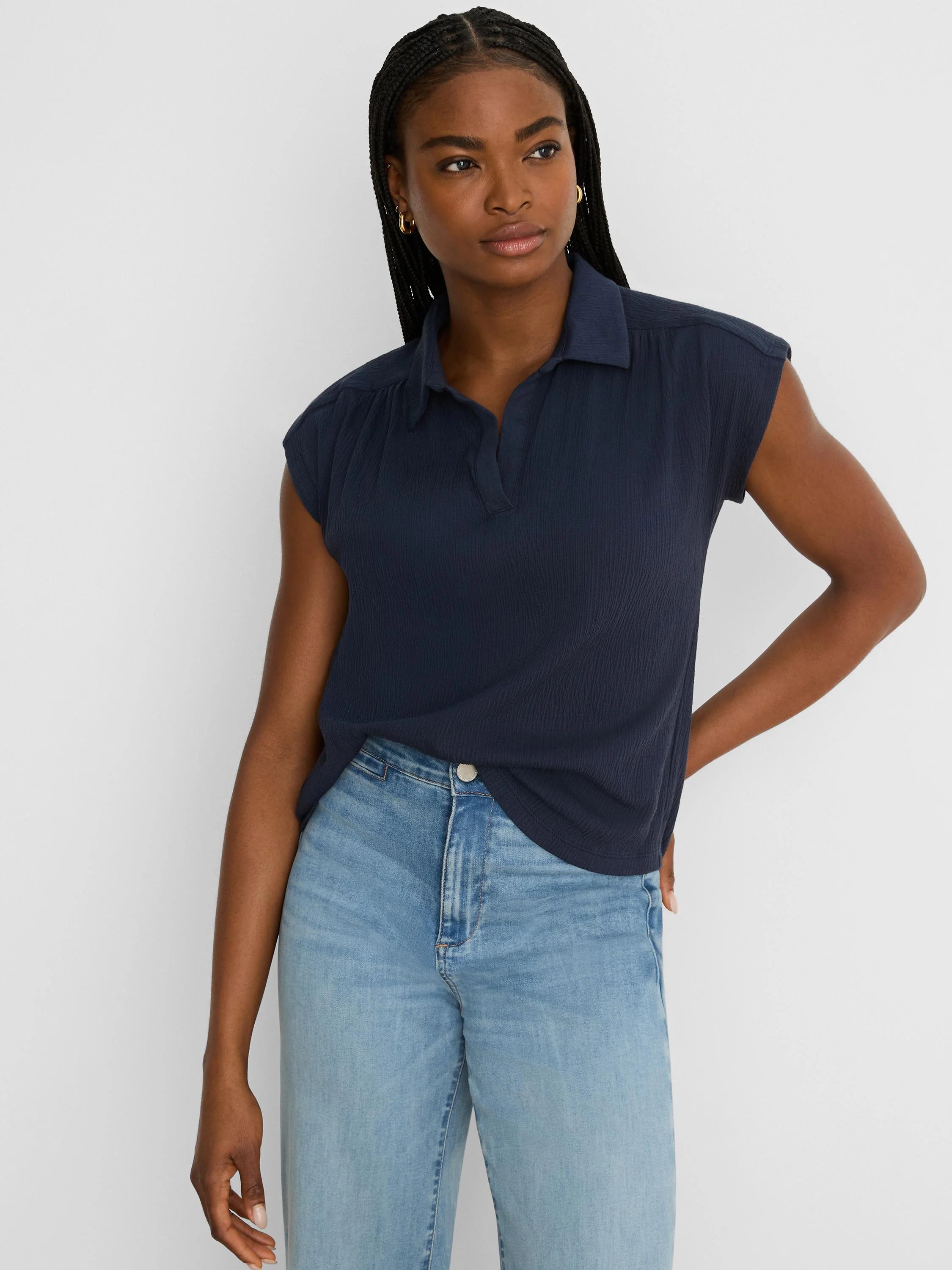 Navy crinkle-textured collared V-neck top with cap sleeves.