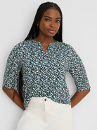 Aqua top with dark blue & white vine pattern, notched V-neck, and 3/4 sleeves.