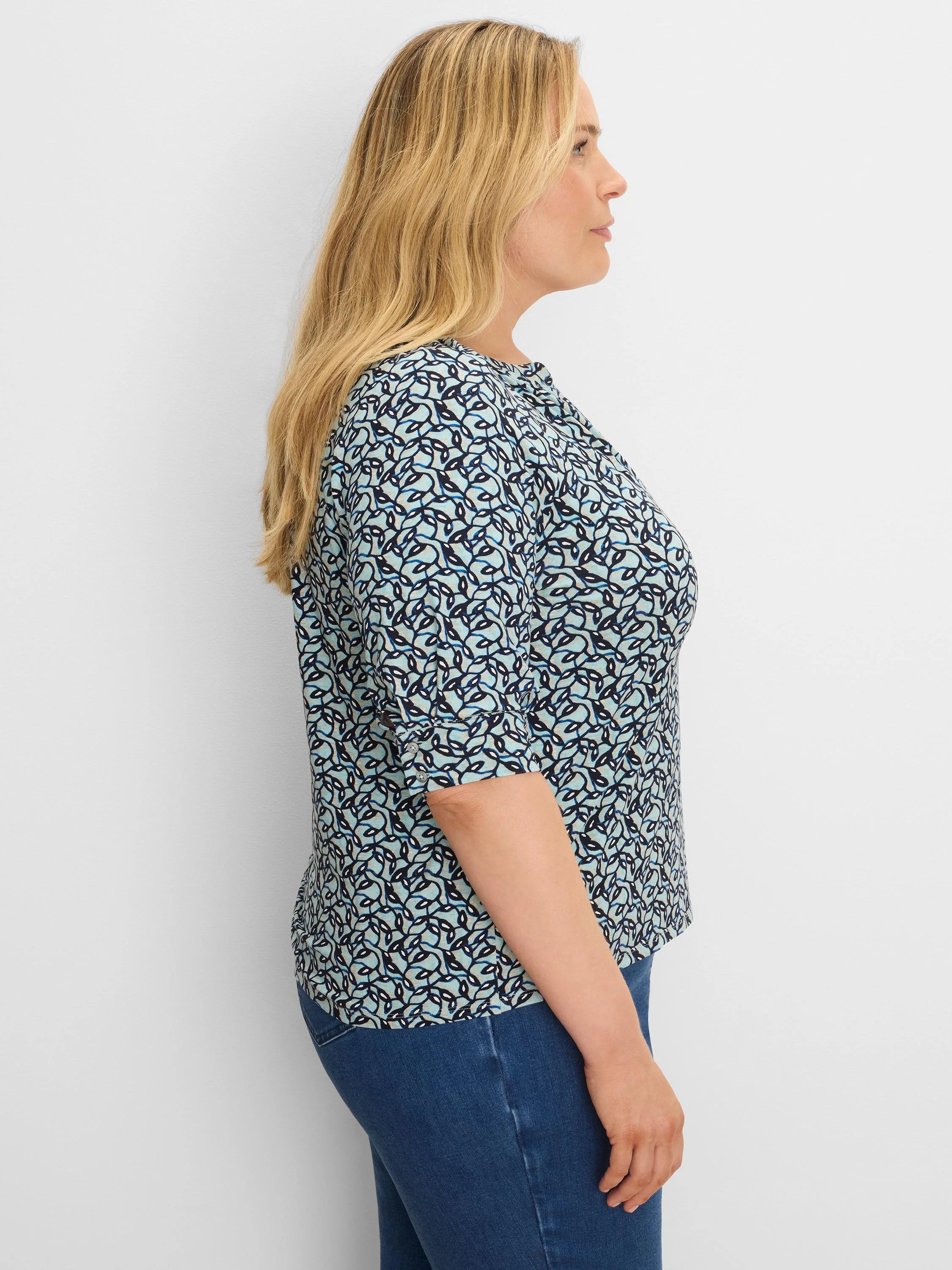 Aqua top with dark blue & white abstract vine pattern, 3/4 sleeves, round neck.