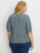 Aqua and navy leaf pattern top with 3/4 roll-tab sleeves and a shirred back.