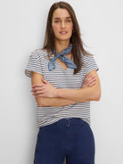 Textured cream & navy diamond stripe V-neck top with short sleeves.