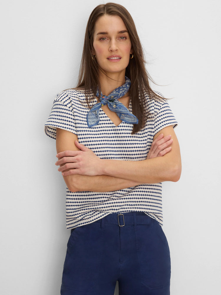 Textured cream & navy diamond stripe V-neck top with short sleeves.