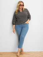 Black knit top with textured off-white horizontal stripes, a collared V-neck, and 3/4 sleeves.