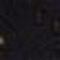 Dark, almost black, with a subtle, unevenly textured surface, appearing slightly mottled.