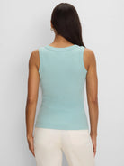 Pale aqua ribbed knit tank top, seen from the back, featuring a wide scoop neckline.