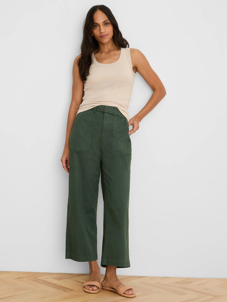 Light beige ribbed knit scoop tank, with clear vertical texture and scoop neckline visible.