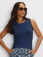 Navy blue rib knit tank with silver studs along the scoop neck and shoulder lines.