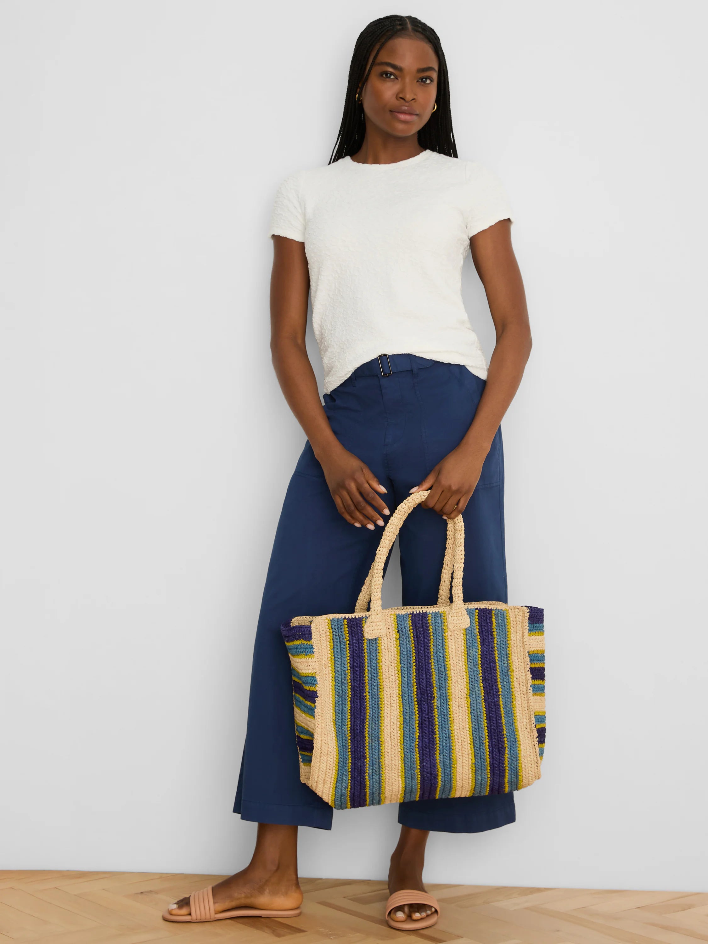 White short-sleeve tee with an all-over subtle raised texture.