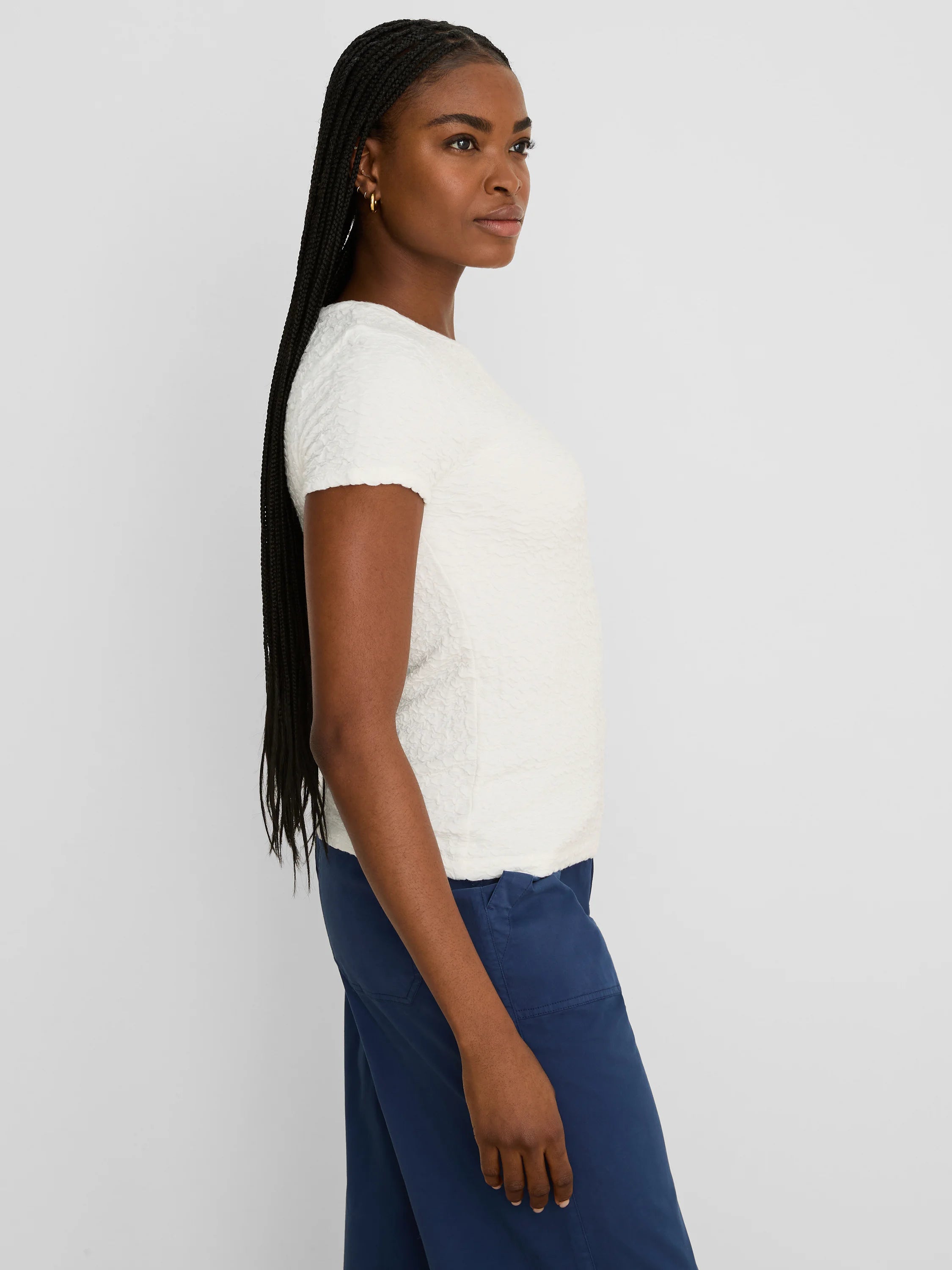 Off-white short-sleeve tee with an all-over crinkled texture.