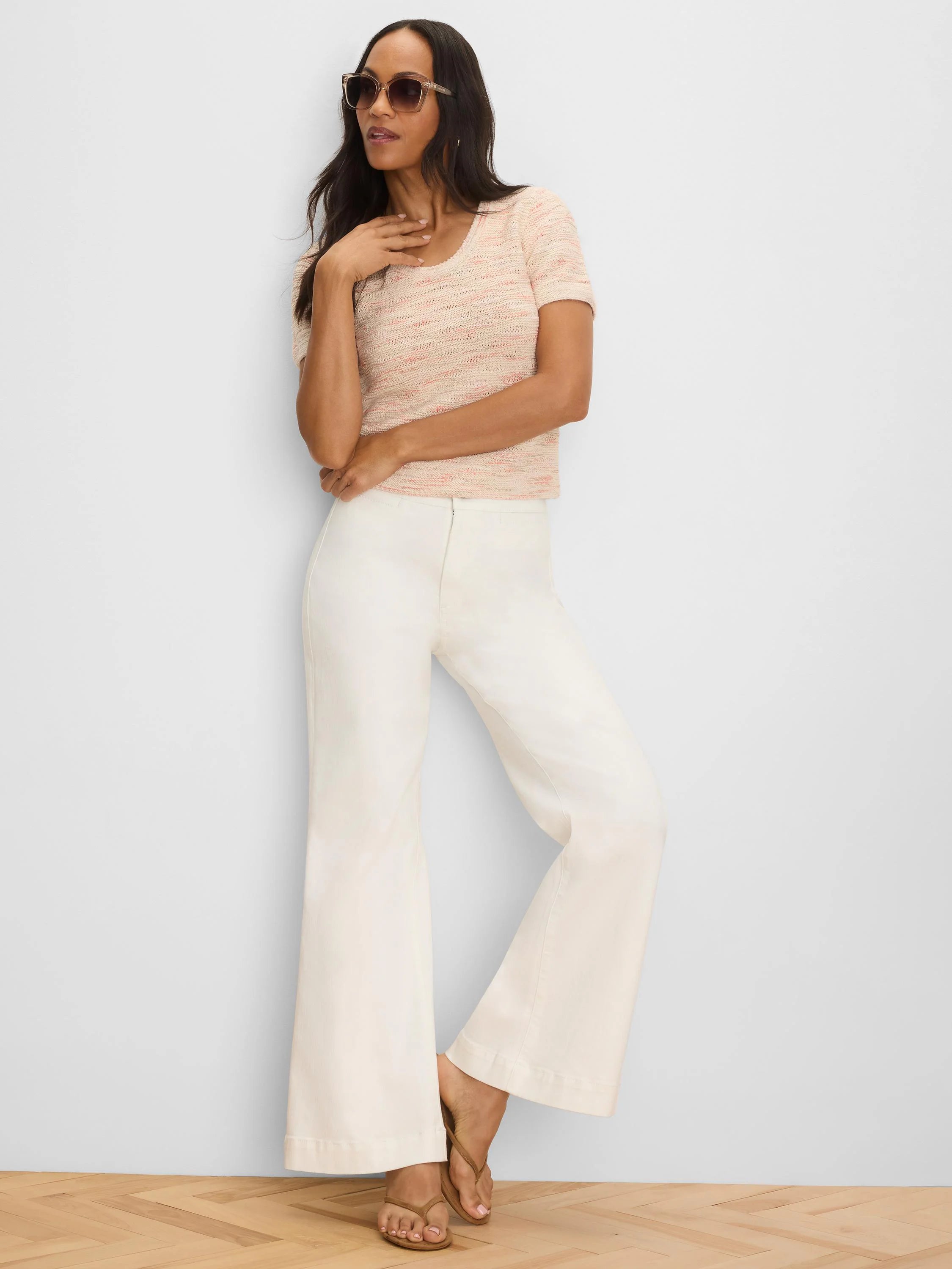 Light peach short-sleeve sweater tee with subtle pink waves in the woven texture, scoop neck.