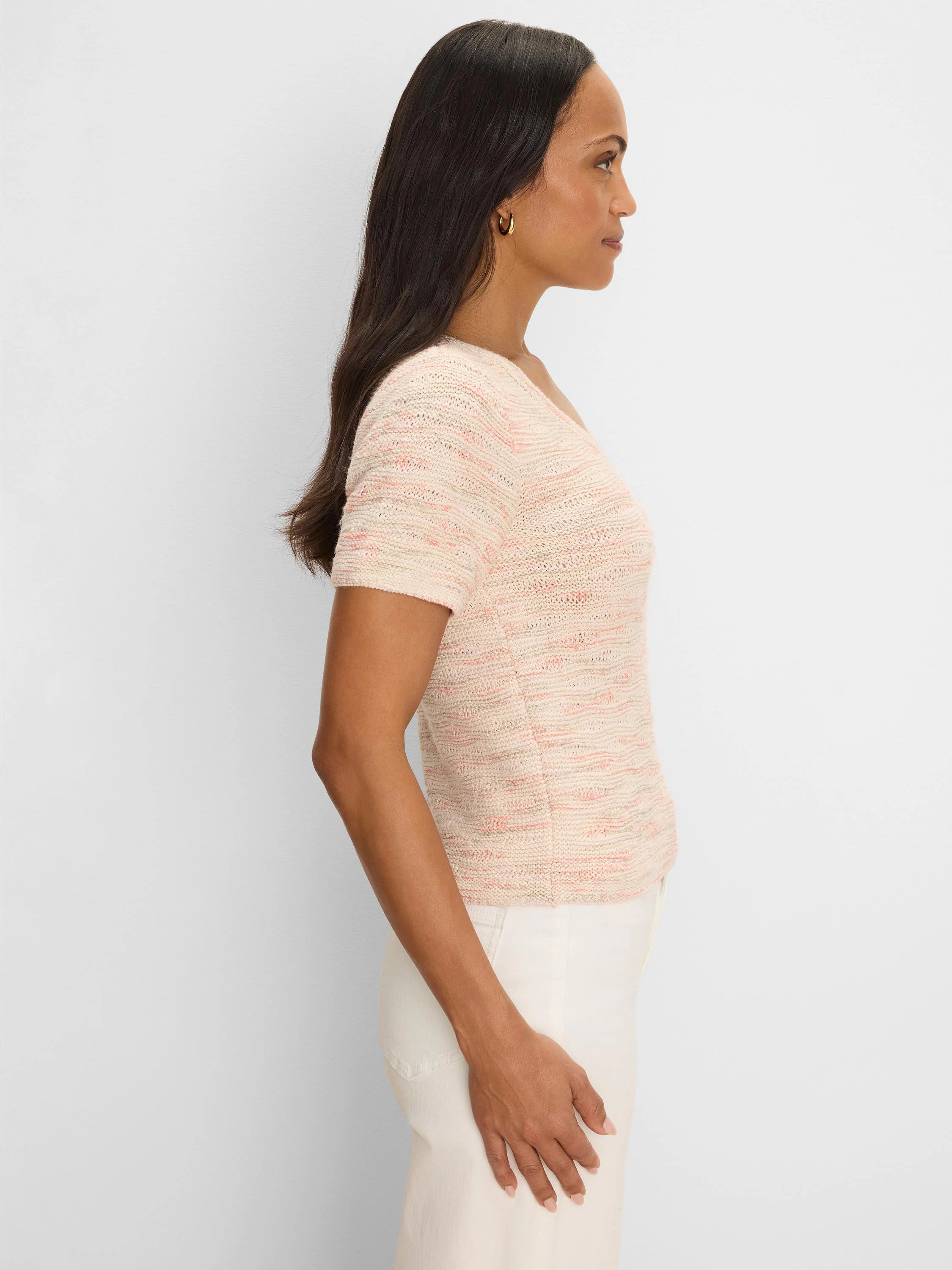 Light cream short-sleeve tee with a textured wave knit, flecked with subtle pink, coral, and light grey yarns.