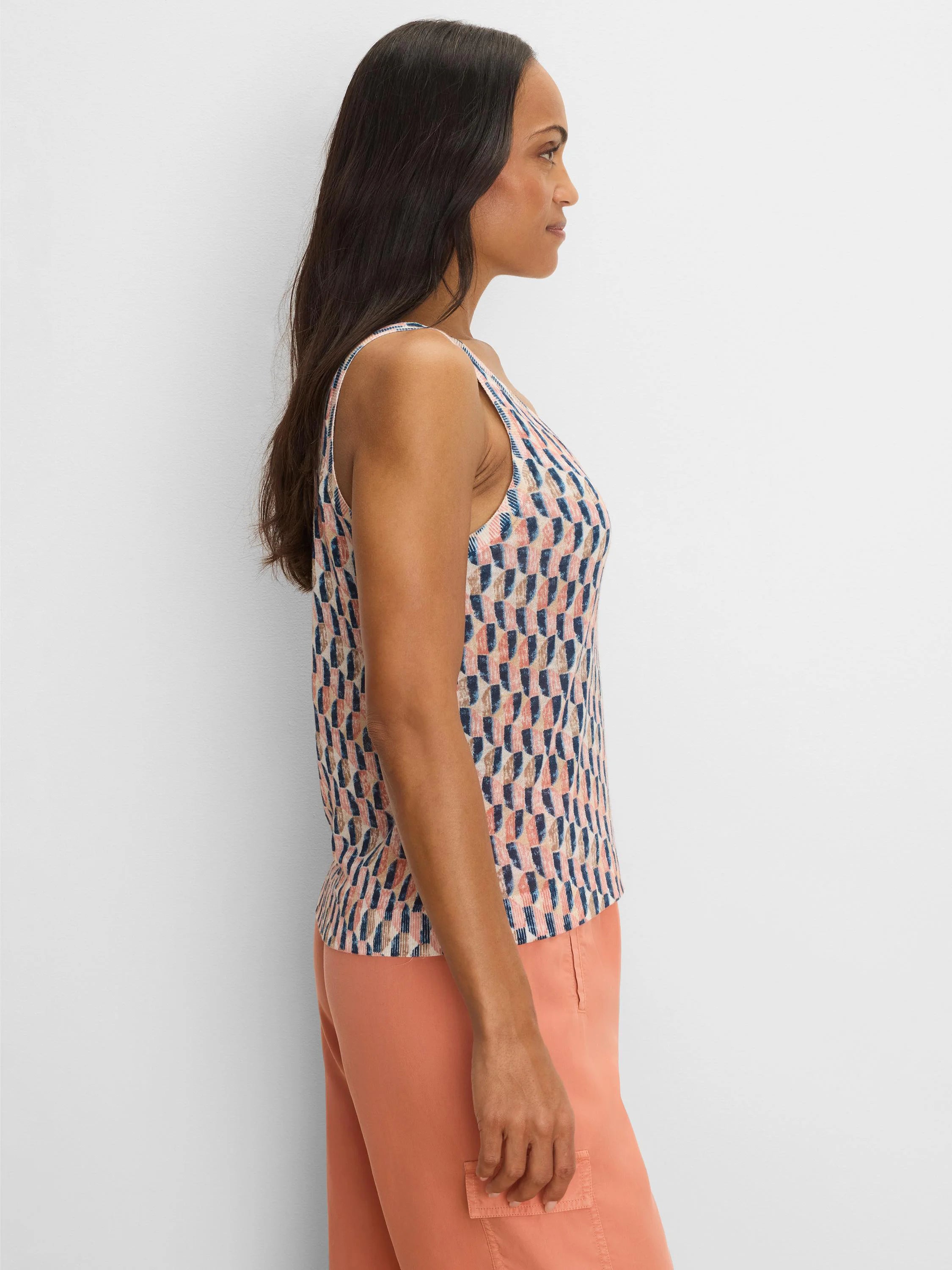 Knit tank top with an abstract sideways block pattern in peach, navy, and beige.