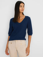 Navy scallop texture sweater tee with scallop V-neck and 3/4 sleeves, worn by a model.