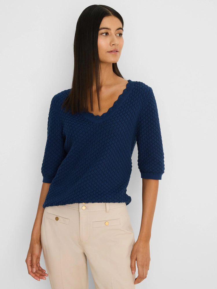 Navy scallop texture sweater tee with scallop V-neck and 3/4 sleeves, worn by a model.