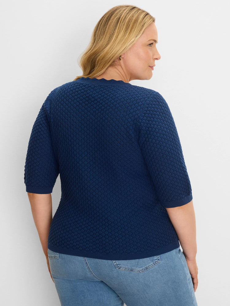 Navy blue scallop texture sweater tee with elbow sleeves, ribbed cuffs and hem.