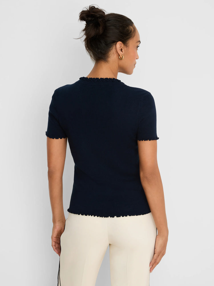 Dark blue ribbed sweater tee with short sleeves and ruffle trim on the neck, sleeve cuffs, and bottom hem.