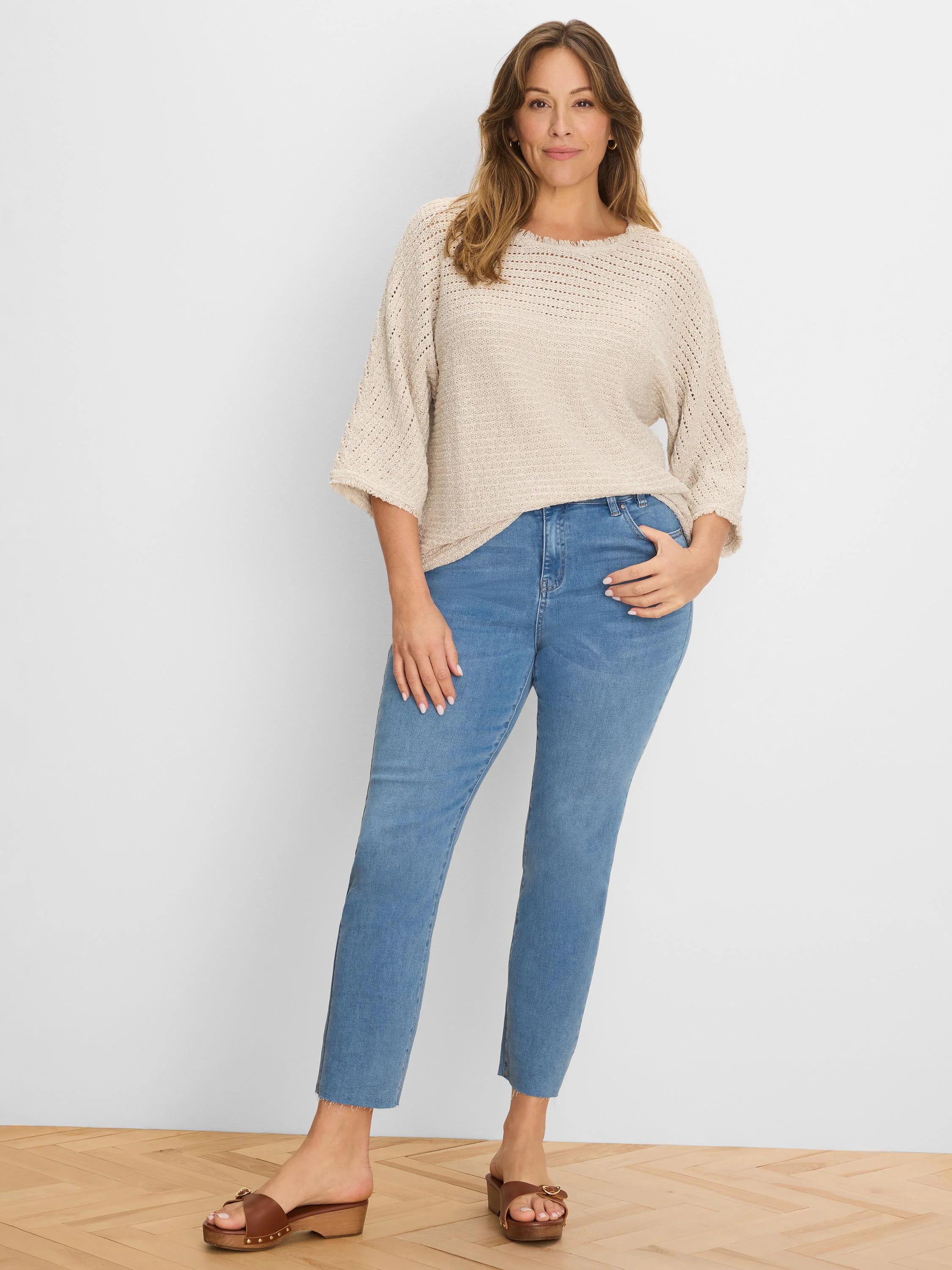 Oatmeal open-knit sweater, loose fit, with fringed neckline/cuffs and 3/4 sleeves.