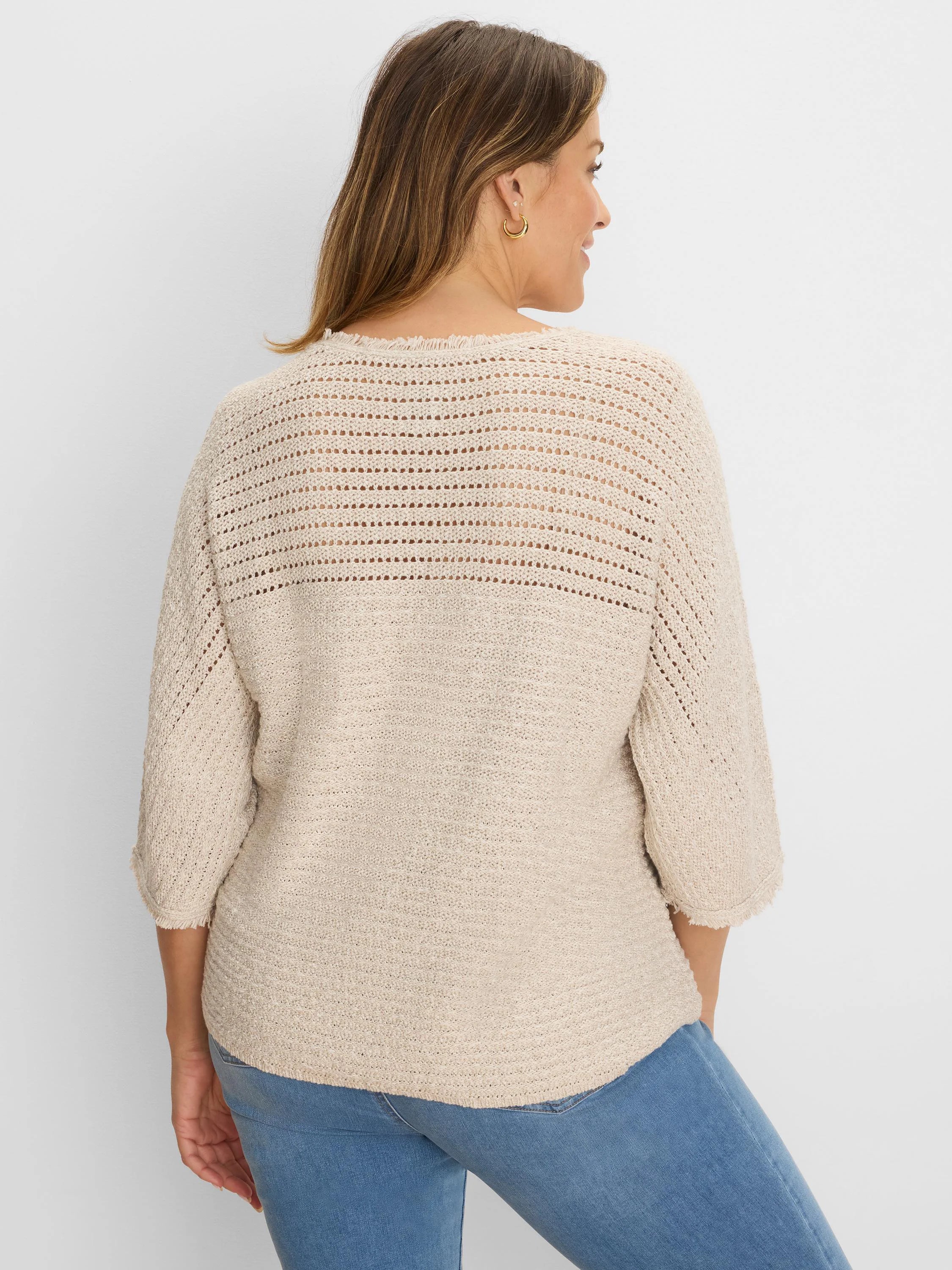 Light beige sweater with open-knit upper back/sleeves, textured knit body, and frayed 3/4 sleeve cuffs & hem.