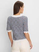 Navy & white open knit sweater with chevron stripes, short sleeves, and scalloped trim.
