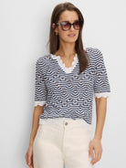 Navy and white chevron knit sweater with scalloped V-neck and short sleeves.