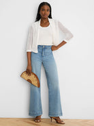 White mesh ruffle cardigan with 3/4 sleeves.