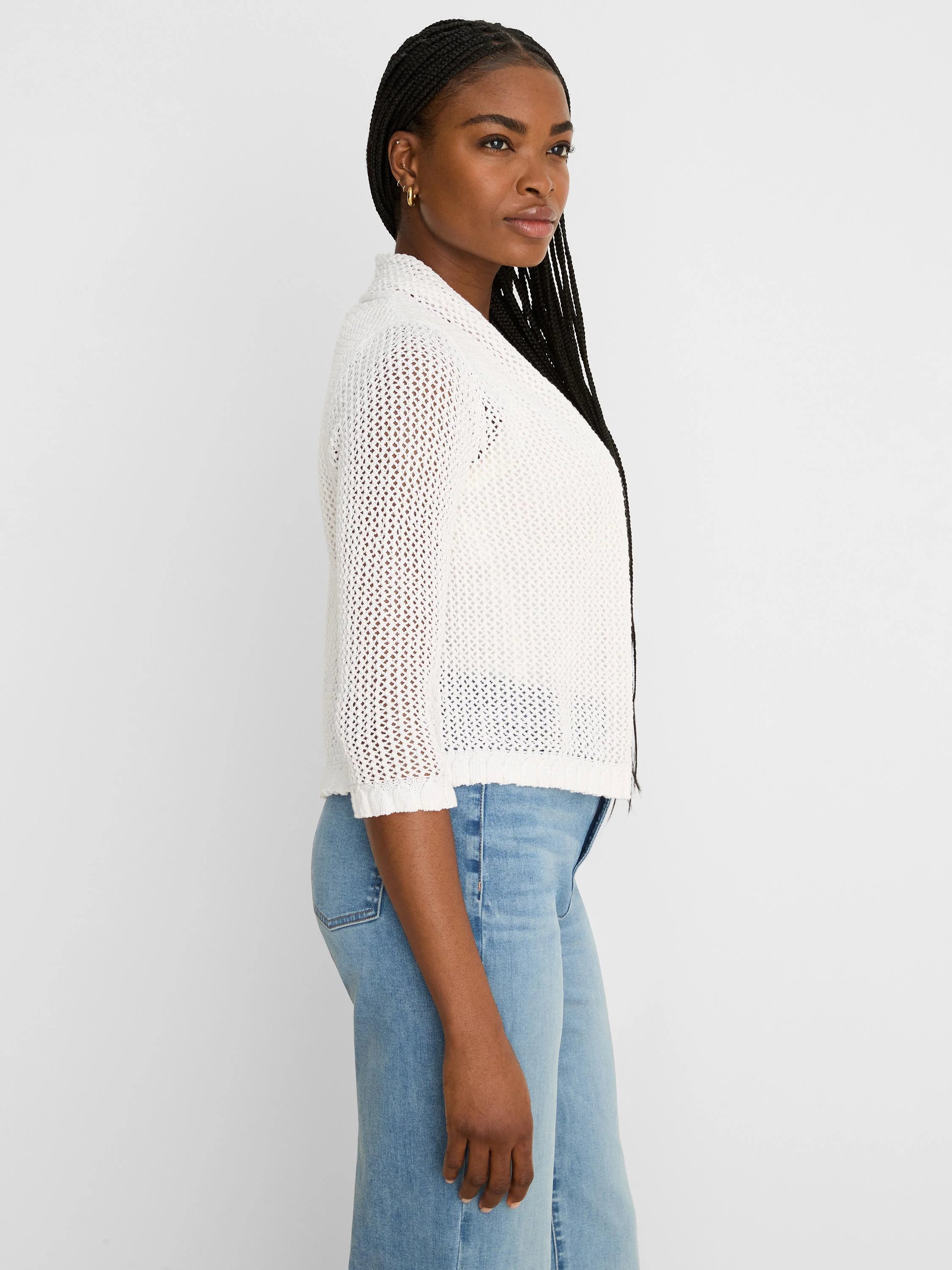 White mesh cardigan with 3/4 sleeves, open knit texture, and ruffled cuffs and hem.