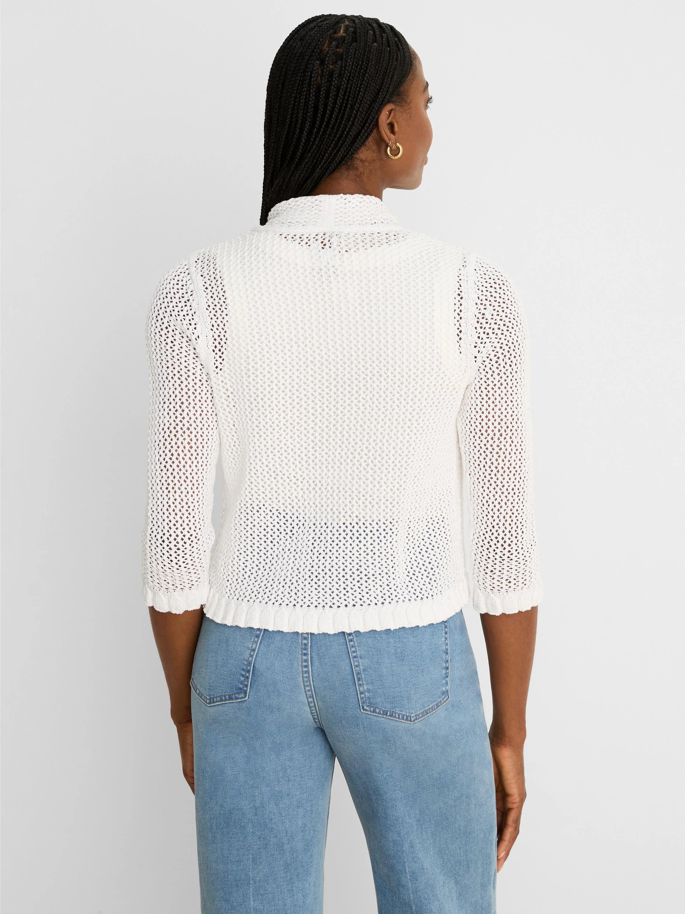 White mesh knit cardigan with a mock neck, 3/4 sleeves, and ruffled cuffs/hem, shown from the back.