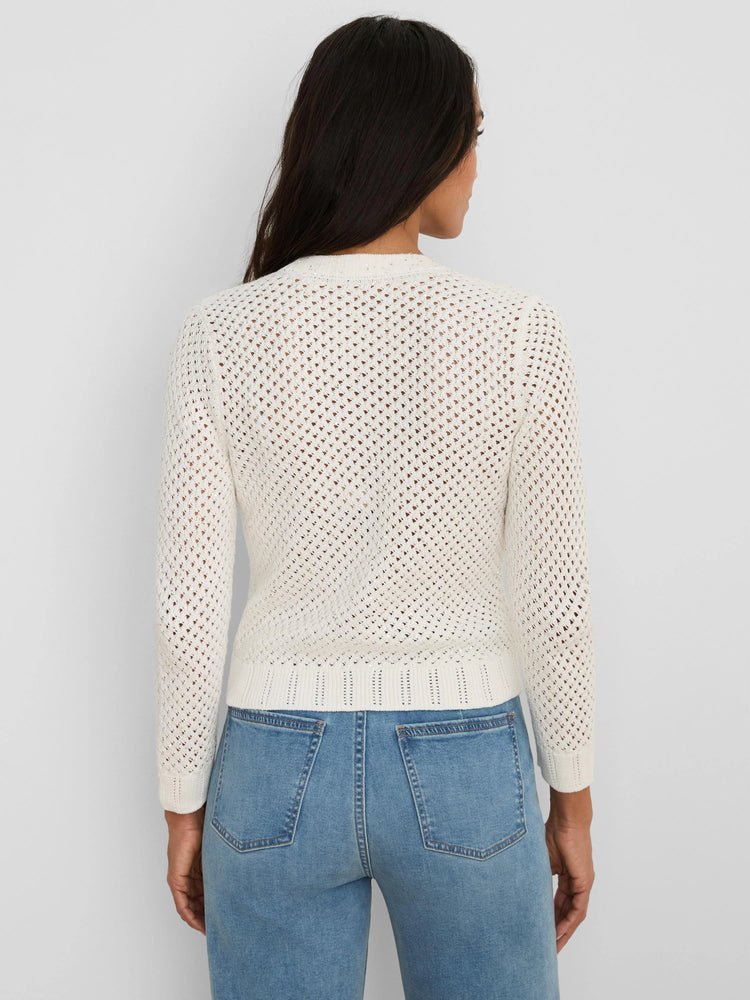 Cream open-knit cardigan with subtle sequins and ribbed trim, back view on model in jeans.
