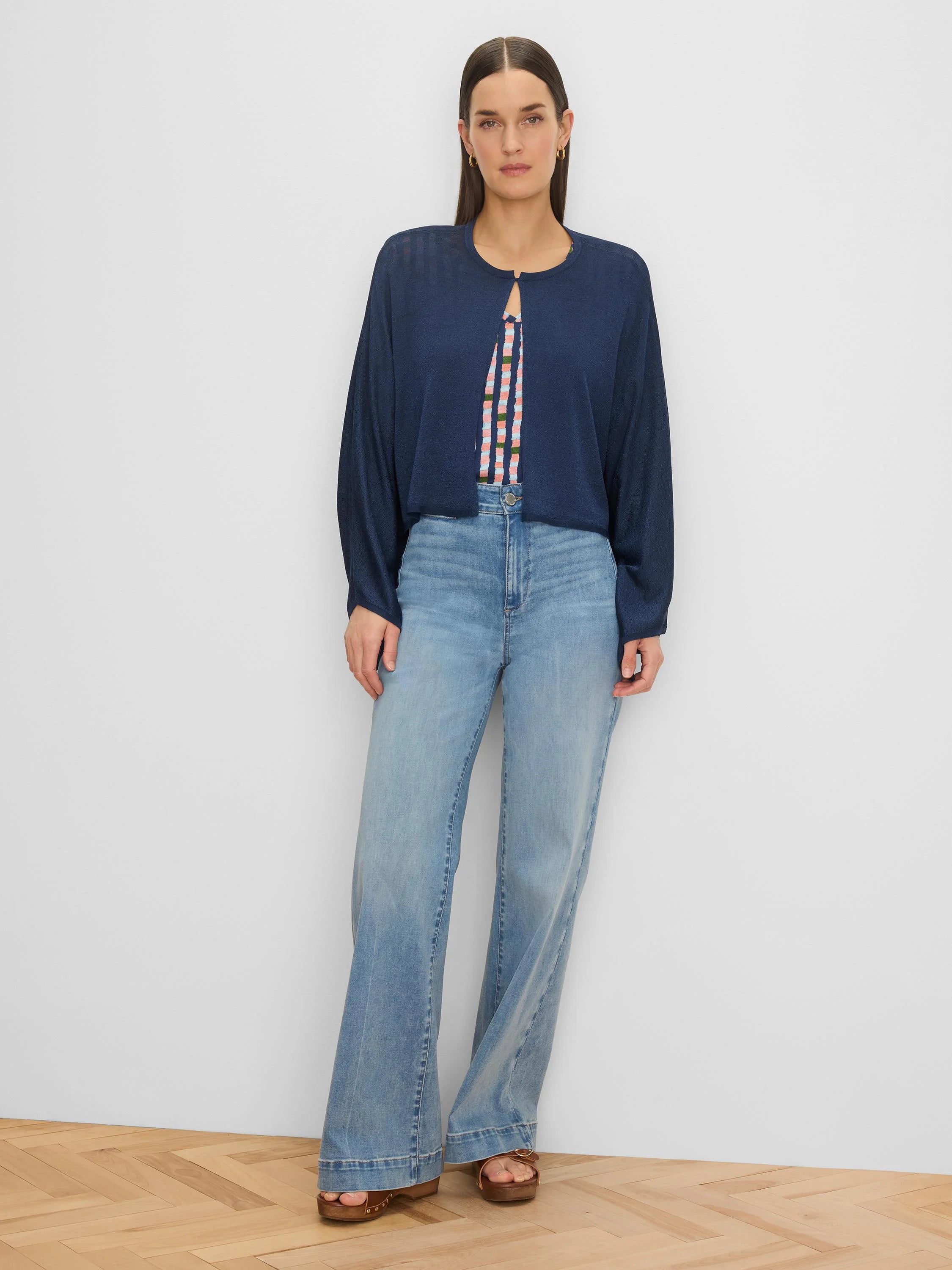 Navy blue open cardigan with long sleeves, a keyhole neck, and a slightly sheer, lightweight fabric.