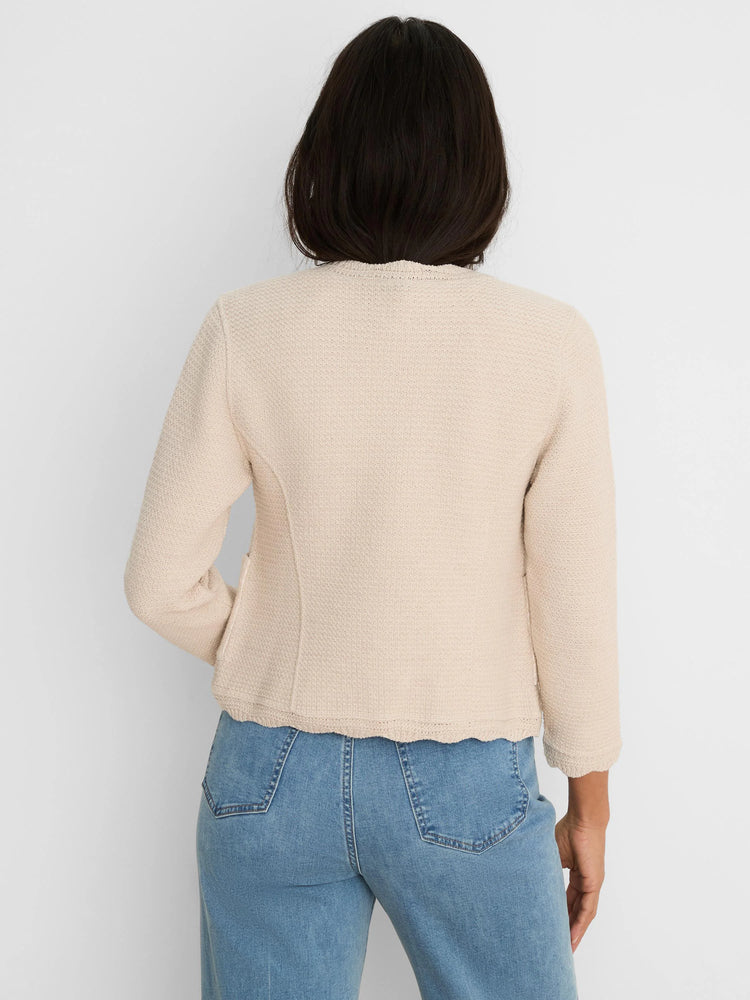 Cream weave-mix knit jacket, viewed from the back. Features scallop trim at the neckline and hem.