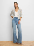 Open-front knit jacket: cream and light blue textured weave, 3/4 sleeves, dark blue trim, single button.