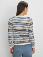 Multi-blue, cream, tan, and black striped cardigan with an open-knit zig-zag pattern, viewed from the back.