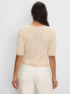 Cream & tan V-stripe crochet sweater with open knit texture and elbow sleeves, back view.