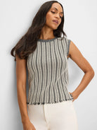 Sleeveless sweater with black & off-white vertical stripes, ribbed crew neck & fringed hem.