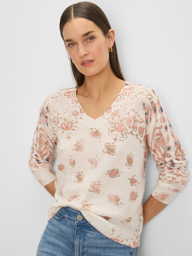 Cream V-neck sweater with pink, blue, and beige paisley pattern.