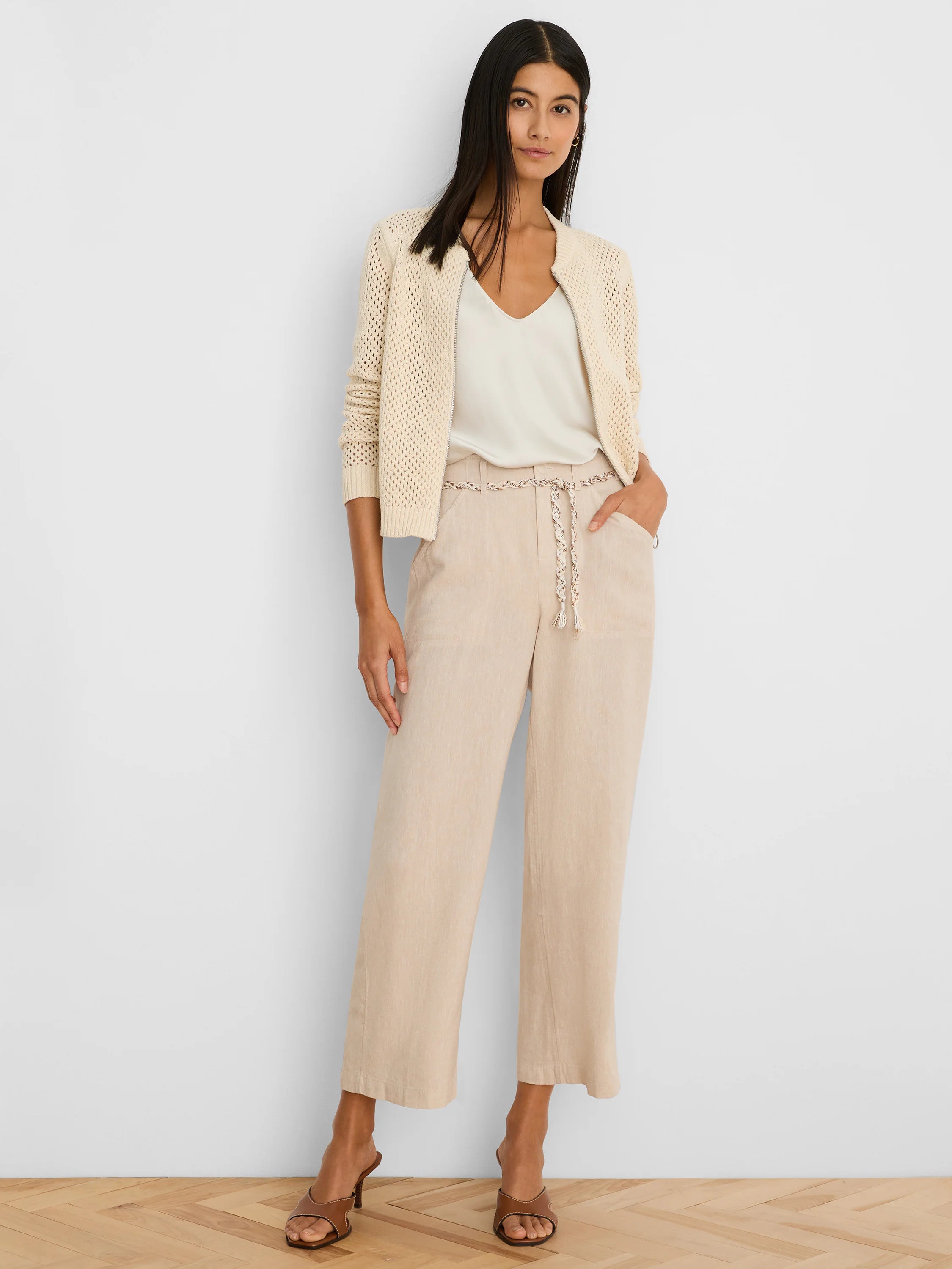 Cream zip-front mesh cardigan.
