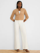 Tan mesh zip-front cardigan with a silver zipper, round neck, 3/4 sleeves, and cropped length.