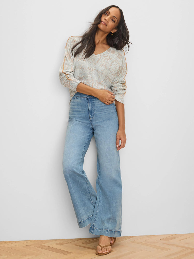 Light grey V-neck sweater with abstract tan print and tan tipping stripes on the long sleeves.