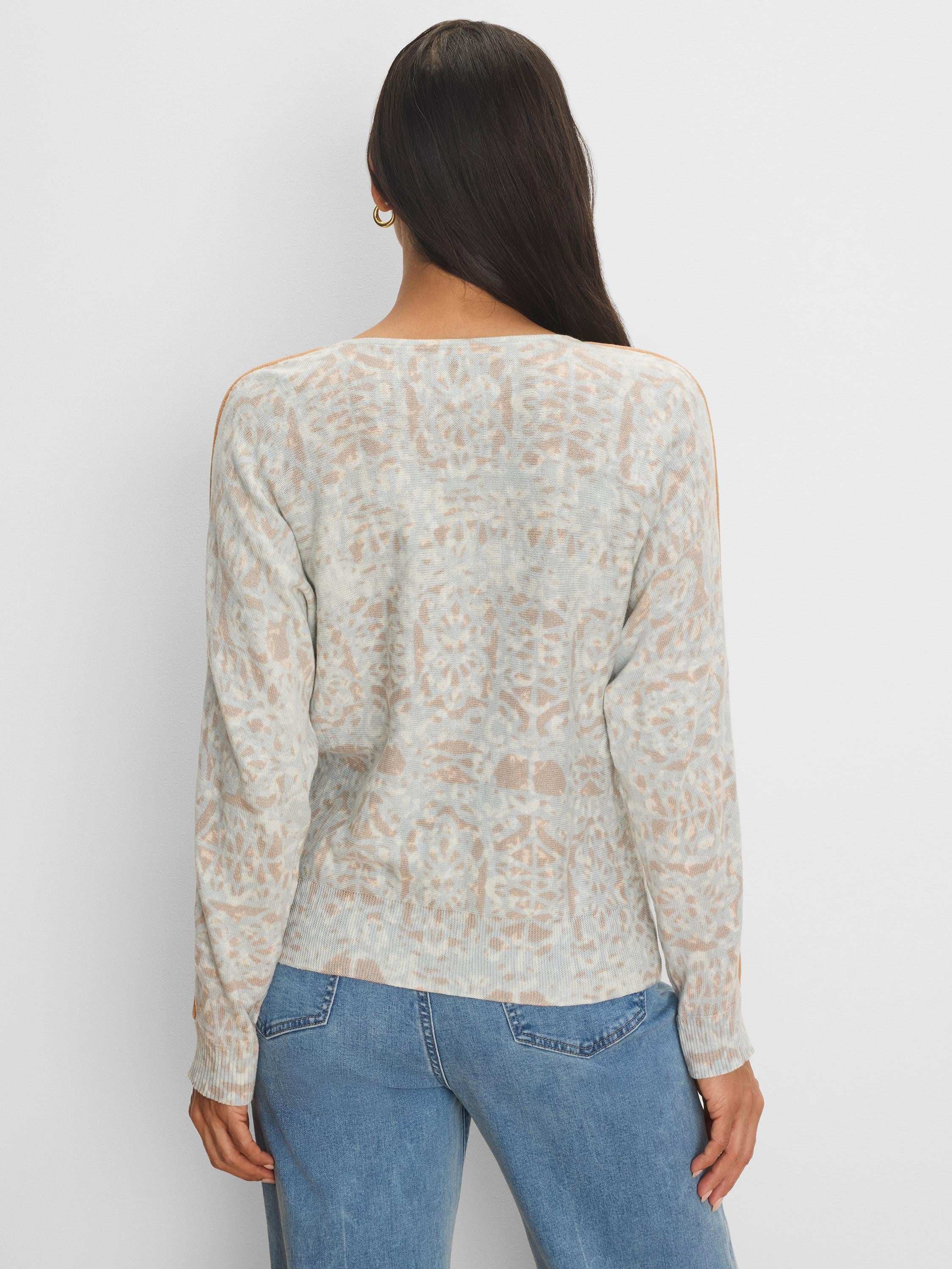 Light gray sweater with tan abstract pattern and tan shoulder tipping. Long sleeve.