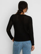 Black long-sleeved sweater with a sheer, open mesh knit pattern.