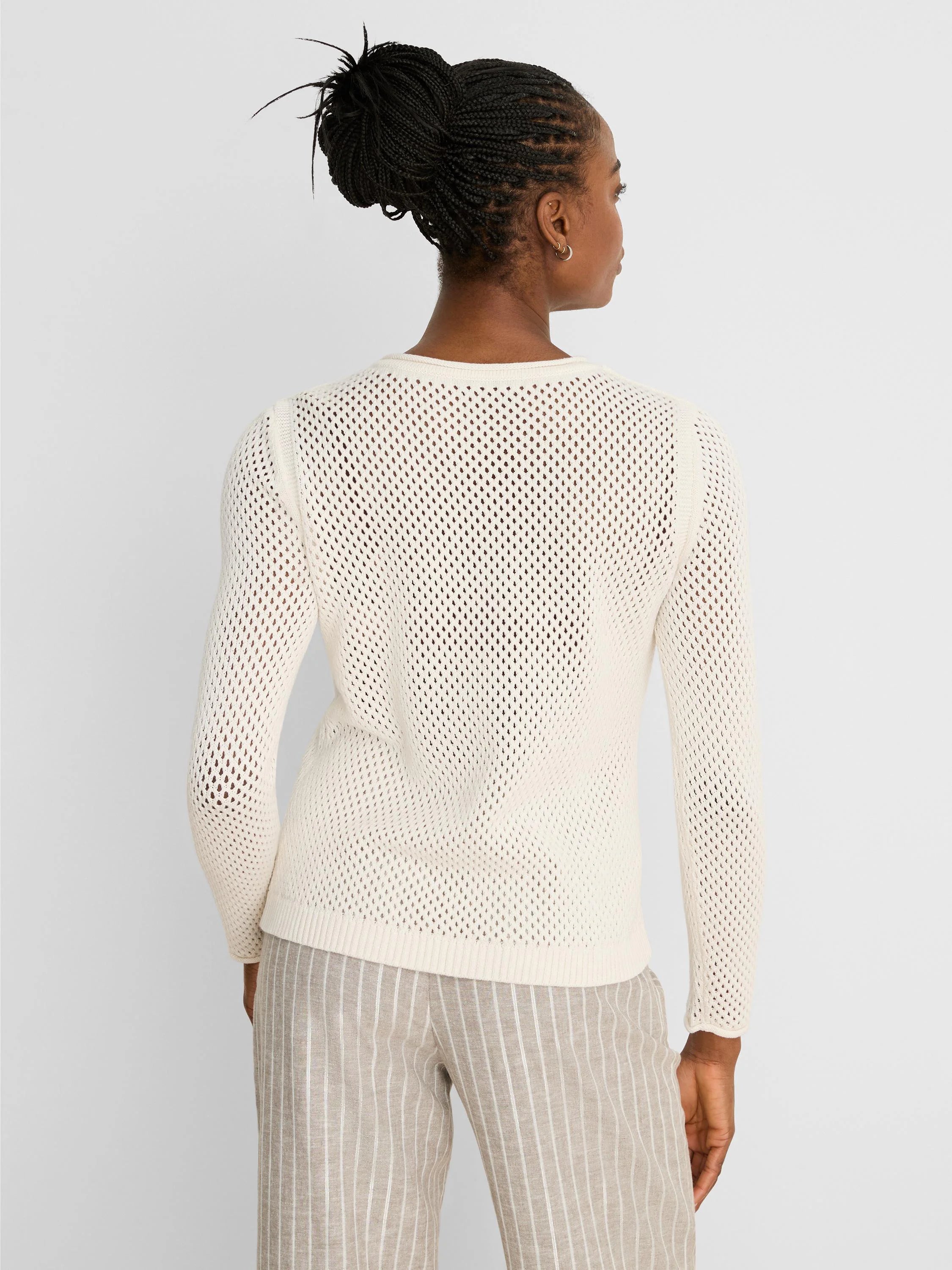 Cream long-sleeved sweater with an open mesh knit and crew neck, shown from the back.